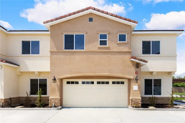 an aerial view of a house with a garden
