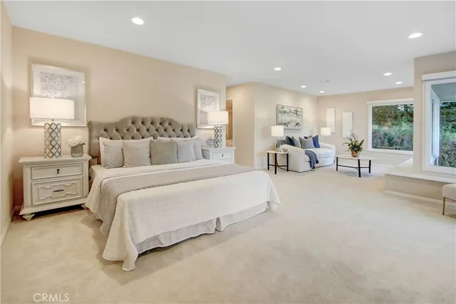a bathroom with a sink double vanity granite and a mirror
