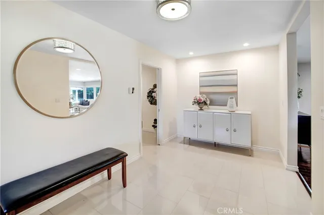 a view of a room with cabinet and mirror