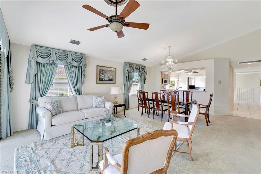 6200 Reserve Circle, Unit 404 Naples, FL 34119 - Photo 14 of 47 a living room with furniture and a large window