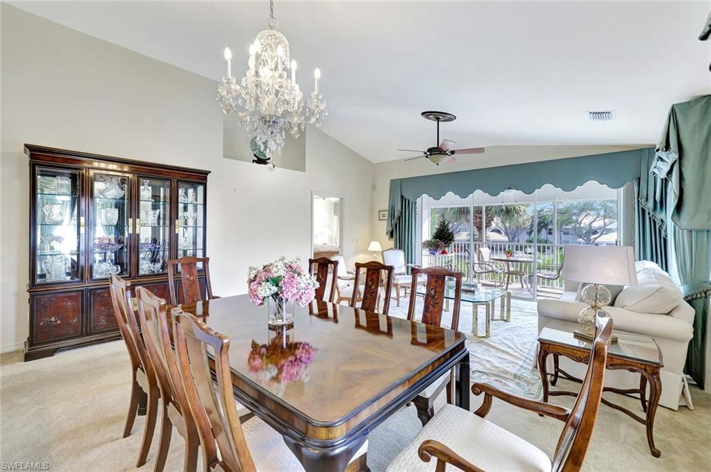 6200 Reserve Circle, Unit 404 Naples, FL 34119 - Photo 16 of 47 a view of a dining room with furniture window and outside view