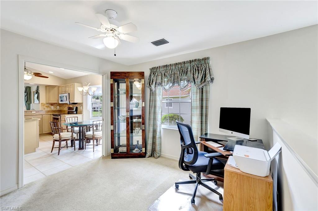 6200 Reserve Circle, Unit 404 Naples, FL 34119 - Photo 27 of 47 a view of a livingroom with workspace and a window