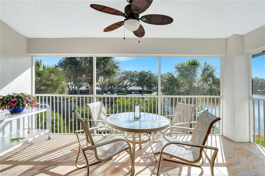 6200 Reserve Circle, Unit 404 Naples, FL 34119 - Photo 30 of 47 a view of a dining room with furniture window and outside view