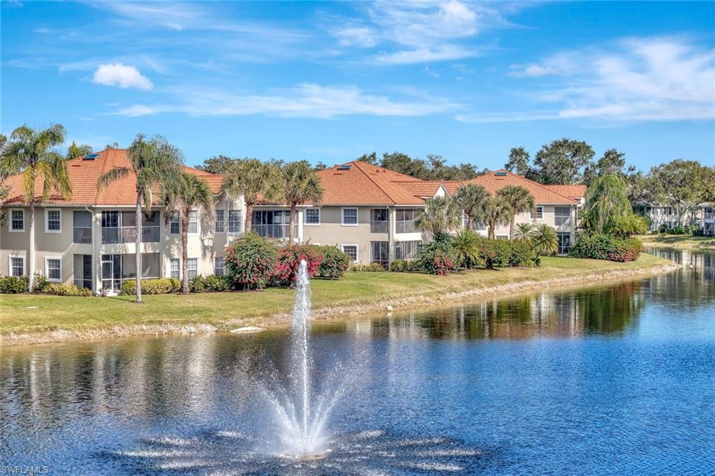 6200 Reserve Circle, Unit 404 Naples, FL 34119 - Photo 5 of 47 a view of a lake with houses