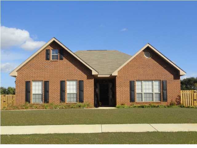 Lot 401 Pin Oak Loop Santa Rosa Beach, FL 32459 - Photo 13 of 13 a front view of a house with a garden