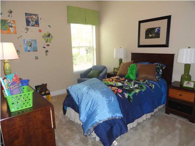 Lot 401 Pin Oak Loop Santa Rosa Beach, FL 32459 - Photo 4 of 13 a bed sitting in a bedroom next to a window