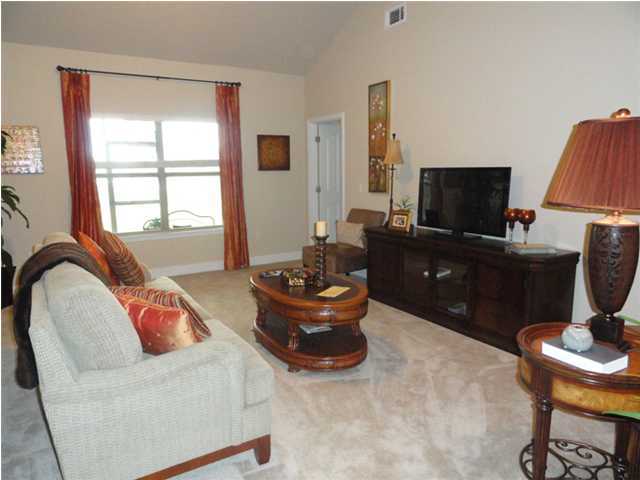 Lot 401 Pin Oak Loop Santa Rosa Beach, FL 32459 - Photo 6 of 13 a living room with a couch and a flat screen tv