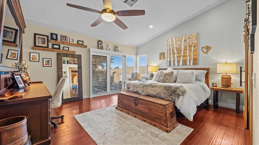 12920 Choco Road Apple Valley, CA 92308 - Photo 14 of 39 Primary bedroom: Primary suite with bamboo flooring and upgraded finishes