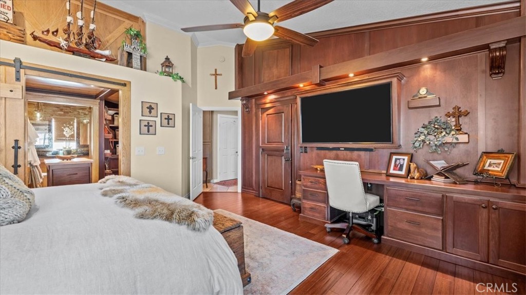 12920 Choco Road Apple Valley, CA 92308 - Photo 15 of 39 Opposite angle of primary suite Custom cherry poplar walk-in closet system showcasing one of the two