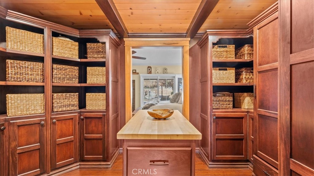 12920 Choco Road Apple Valley, CA 92308 - Photo 17 of 39 Larger custom cherry poplar walk-in closet system which leads into ensuite