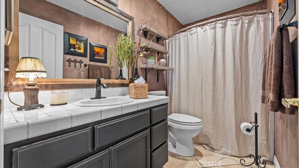 12920 Choco Road Apple Valley, CA 92308 - Photo 20 of 39 Guest bathroom with updated tilework and clean, modern finishes