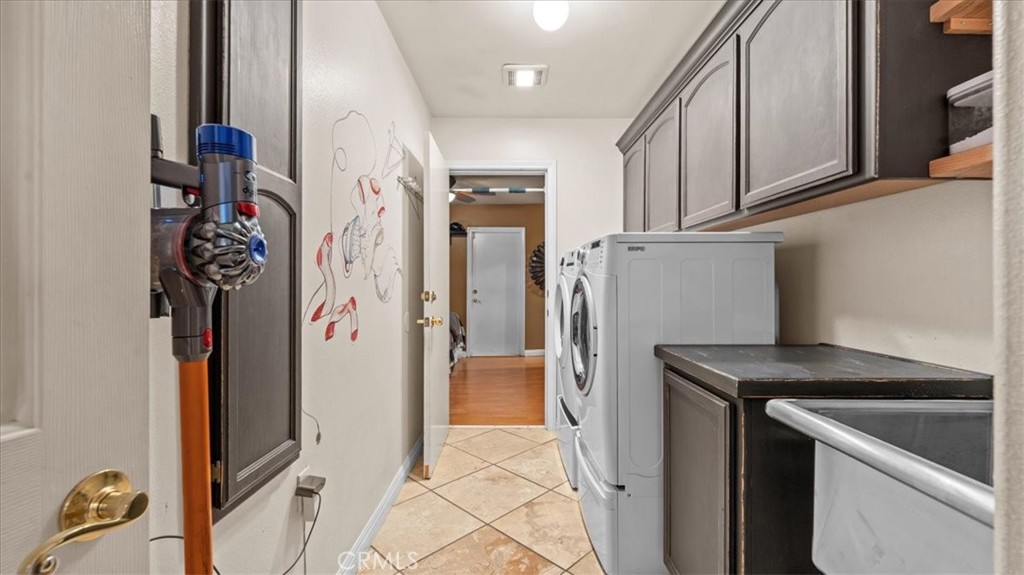 12920 Choco Road Apple Valley, CA 92308 - Photo 24 of 39 Laundry room that leads into the separate-entry bedroom