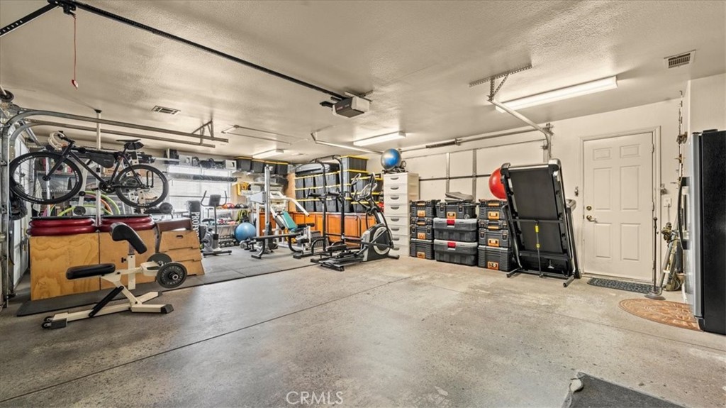 12920 Choco Road Apple Valley, CA 92308 - Photo 25 of 39 Garage: 3-car garage with ample storage and workspace potential