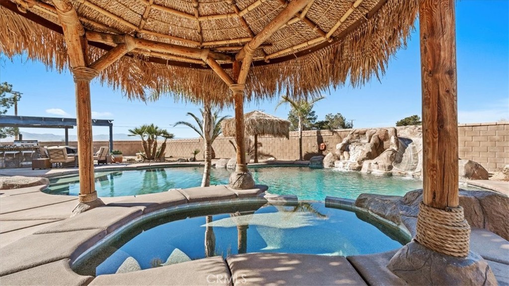 12920 Choco Road Apple Valley, CA 92308 - Photo 27 of 39 Pool & waterfall/slide: Saltwater pool and spa with rock waterfall and slide feature
