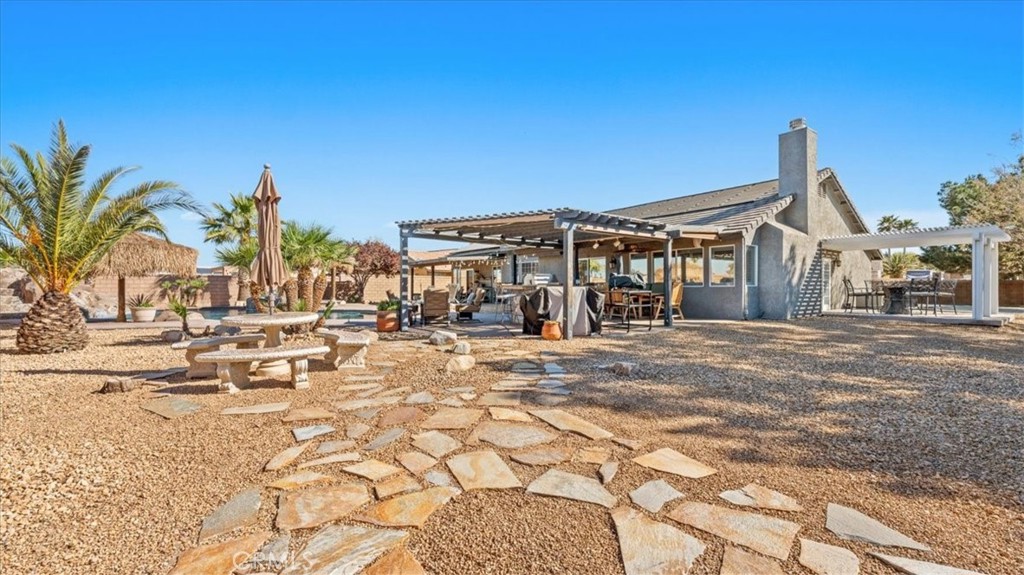 12920 Choco Road Apple Valley, CA 92308 - Photo 31 of 39 Another angle of Backyard wide shot: Multiple outdoor living spaces designed for hosting and relaxation