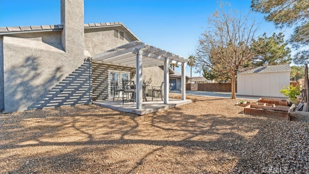 12920 Choco Road Apple Valley, CA 92308 - Photo 33 of 39 Covered patio with elevated deck area—ideal for outdoor dining and lounging