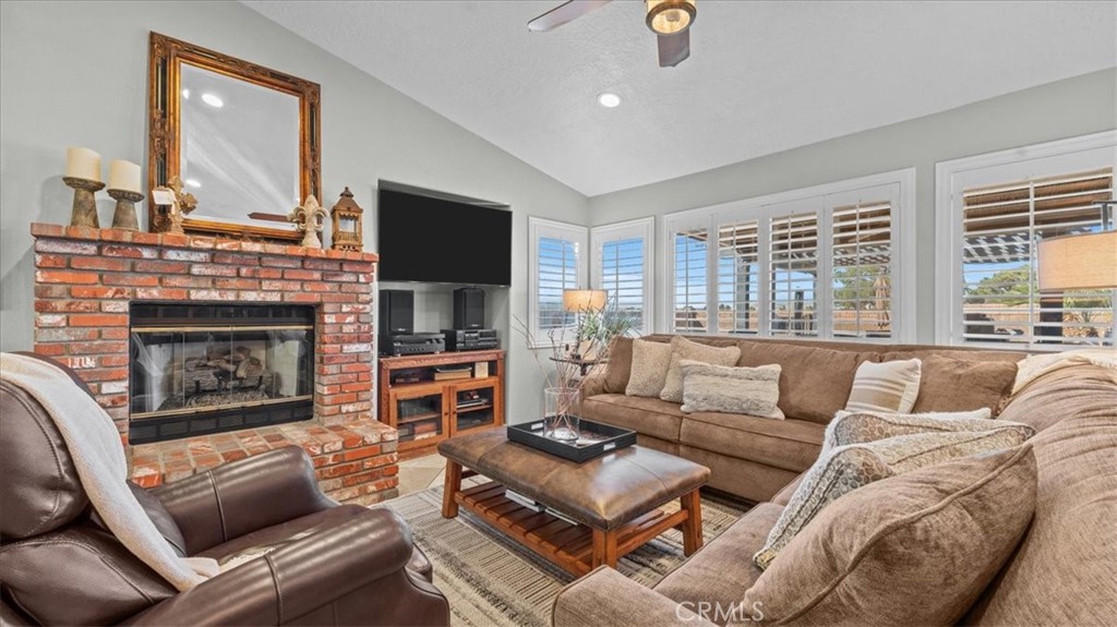 12920 Choco Road Apple Valley, CA 92308 - Photo 5 of 39 Living room: Open living area with natural light and travertine flooring