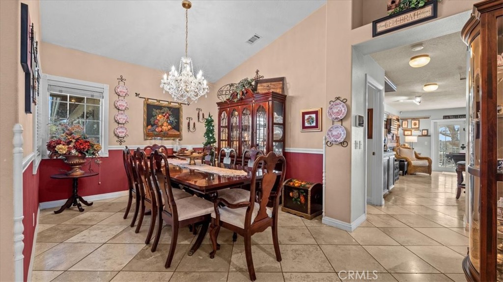 12920 Choco Road Apple Valley, CA 92308 - Photo 10 of 39 Dining room:Dedicated dining space with views of the front yard