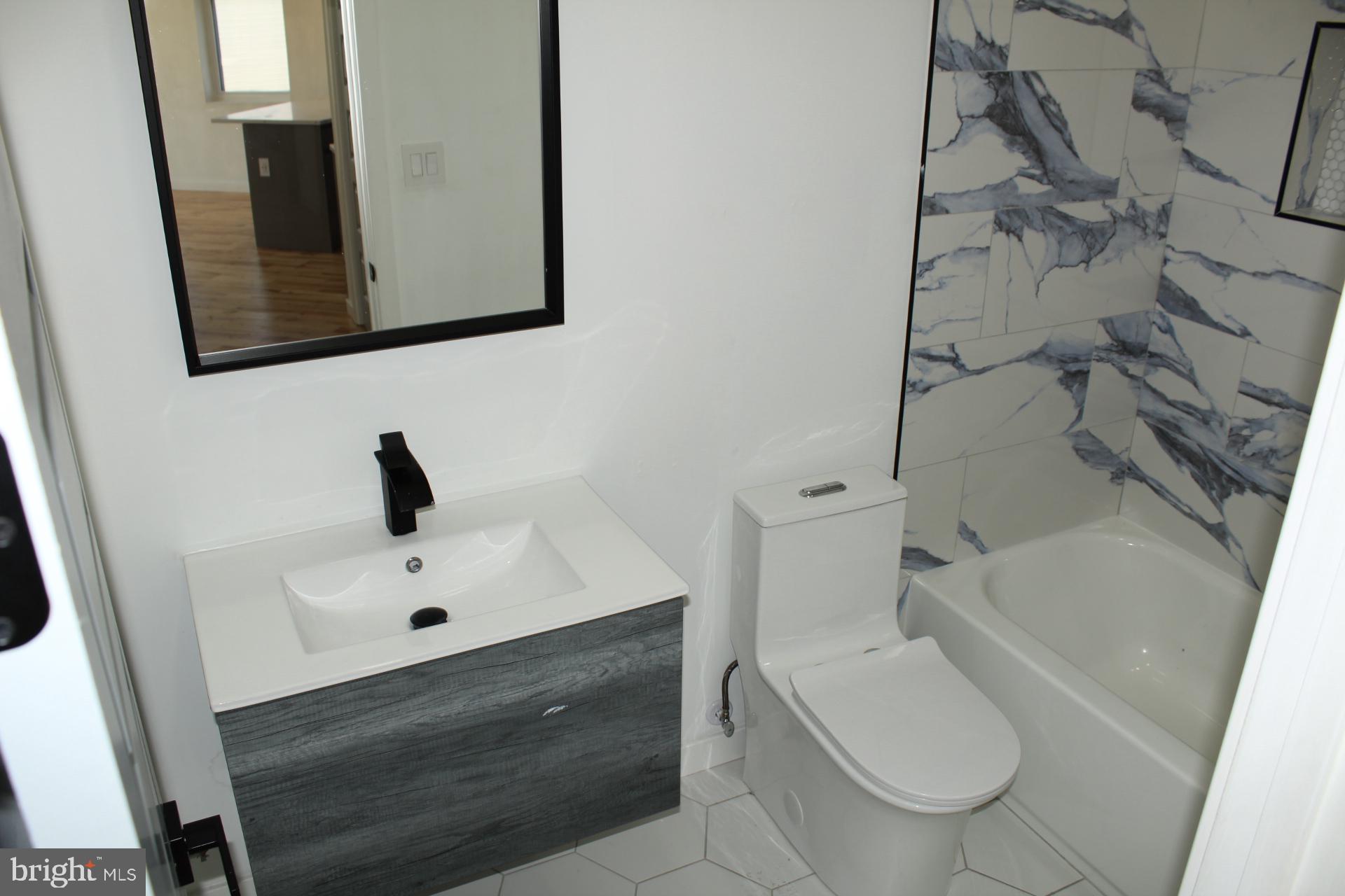 3017 Ridge Avenue, Unit C Philadelphia, PA 19121 - Photo 19 of 27 Modern bathroom with sleek design.