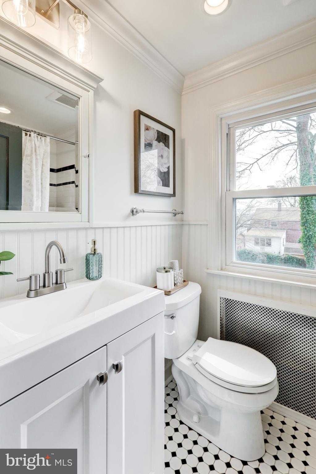 2316 Franklin Avenue Secane, PA 19018 - Photo 17 of 30 a bathroom with a sink a toilet and a window