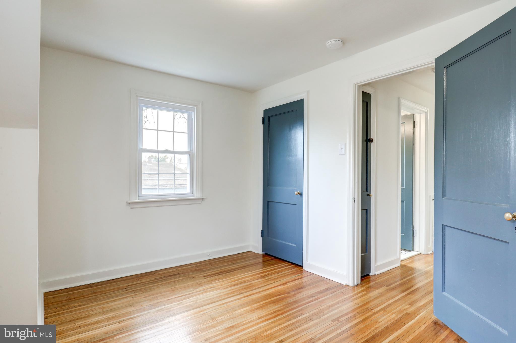 2316 Franklin Avenue Secane, PA 19018 - Photo 23 of 30 an empty room with wooden floor and windows