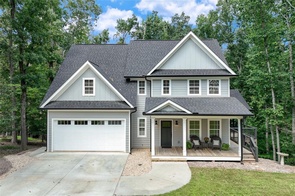 2880 Thompson Mill Road Gainesville, GA 30506 - Photo 1 of 1 a front view of a house with a yard and garage