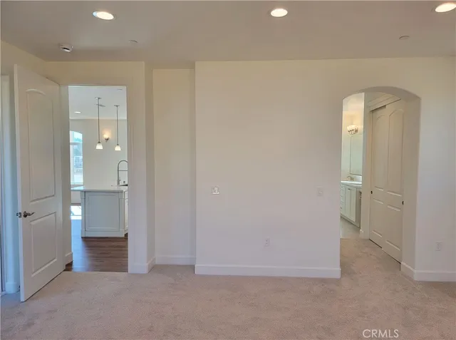 wooden floor and a bathroom with a sink