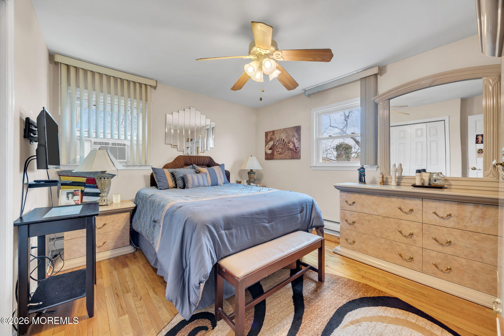 12 Avon Way Parlin, NJ 08859 - Photo 17 of 29 a bedroom with a bed and a flat tv screen on dresser