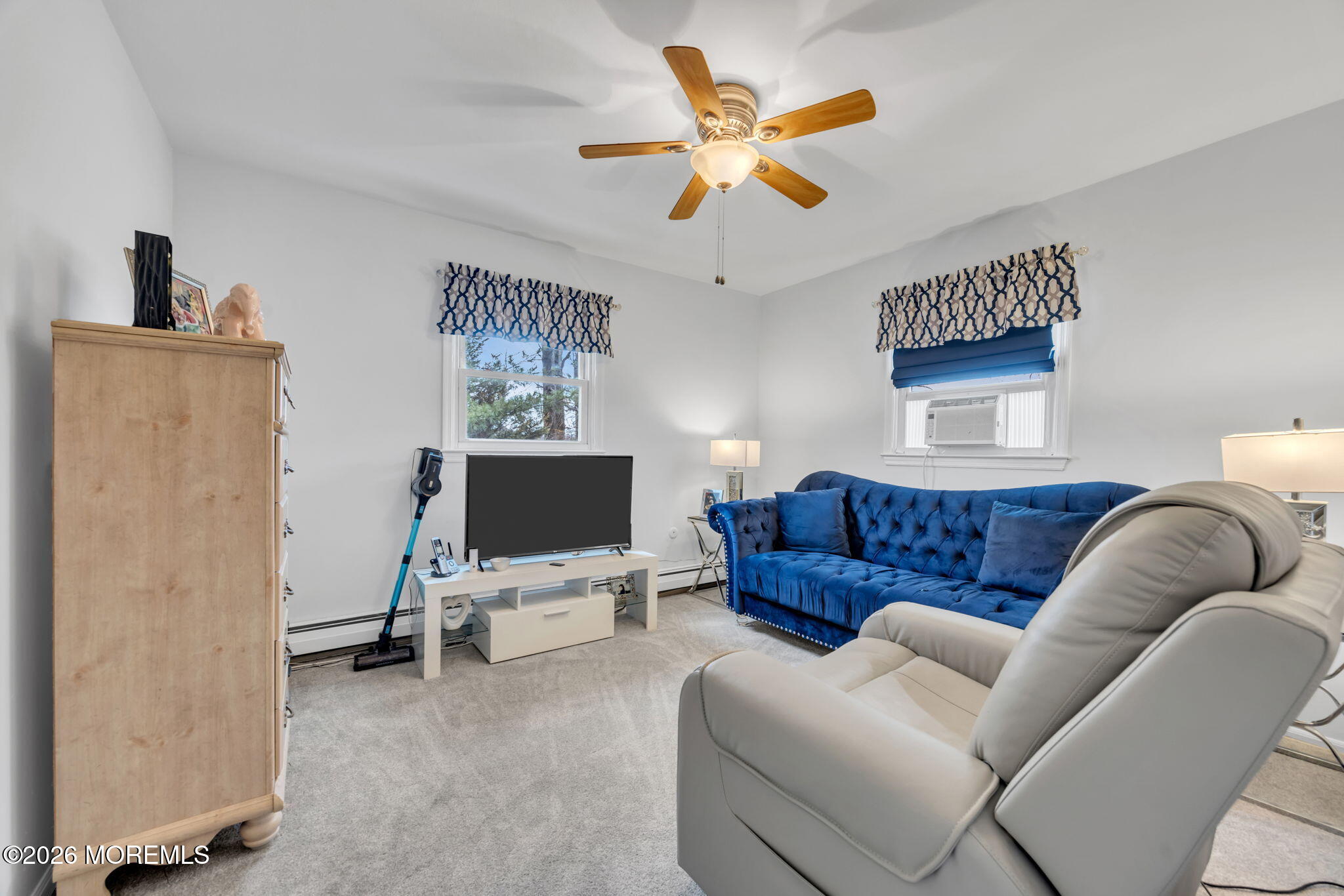 12 Avon Way Parlin, NJ 08859 - Photo 19 of 29 a living room with furniture and a flat screen tv