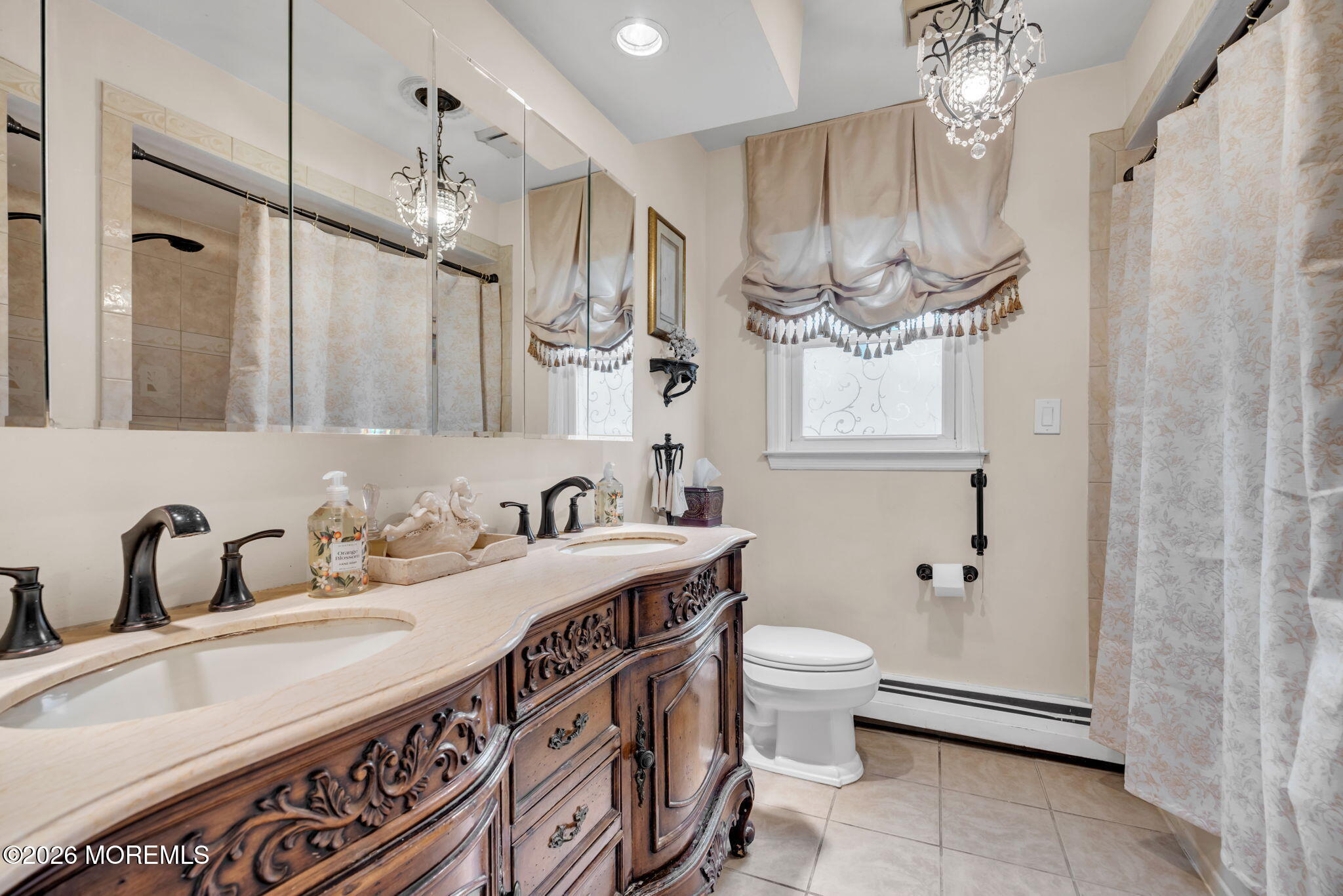 12 Avon Way Parlin, NJ 08859 - Photo 20 of 29 a bathroom with a double vanity sink mirror and toilet