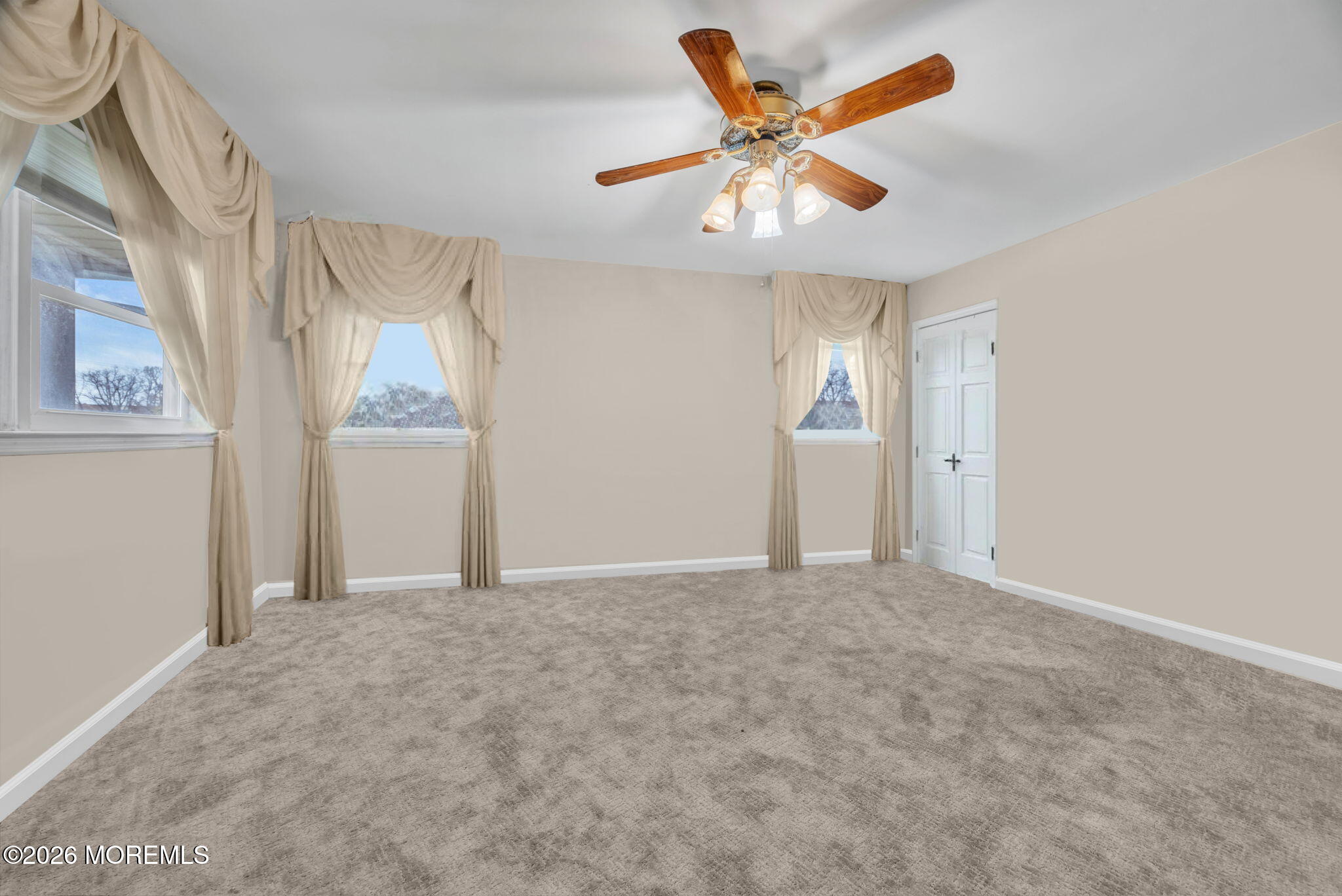 12 Avon Way Parlin, NJ 08859 - Photo 21 of 29 an empty room with windows and fan