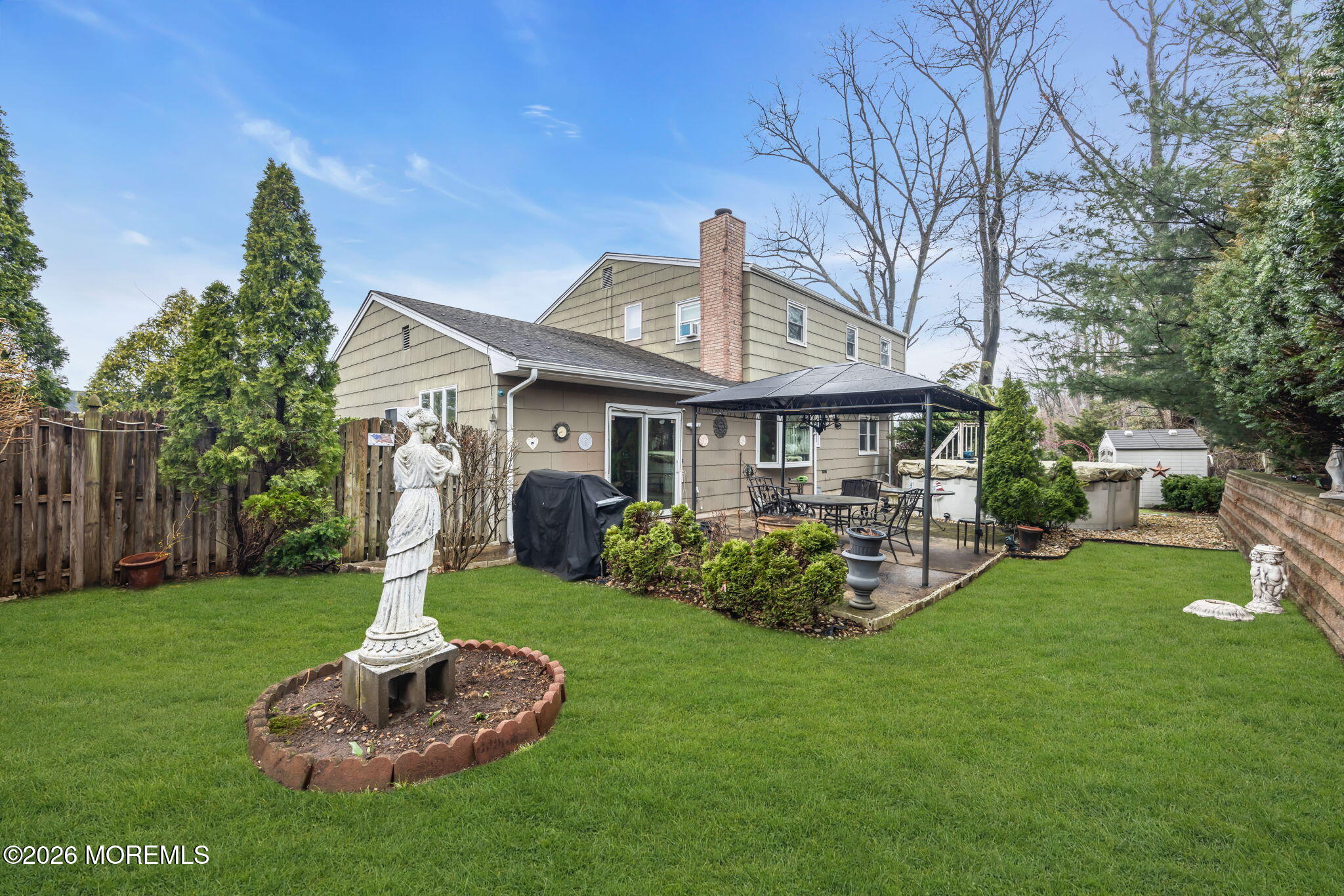 12 Avon Way Parlin, NJ 08859 - Photo 29 of 29 a front view of a house with a yard table and chairs