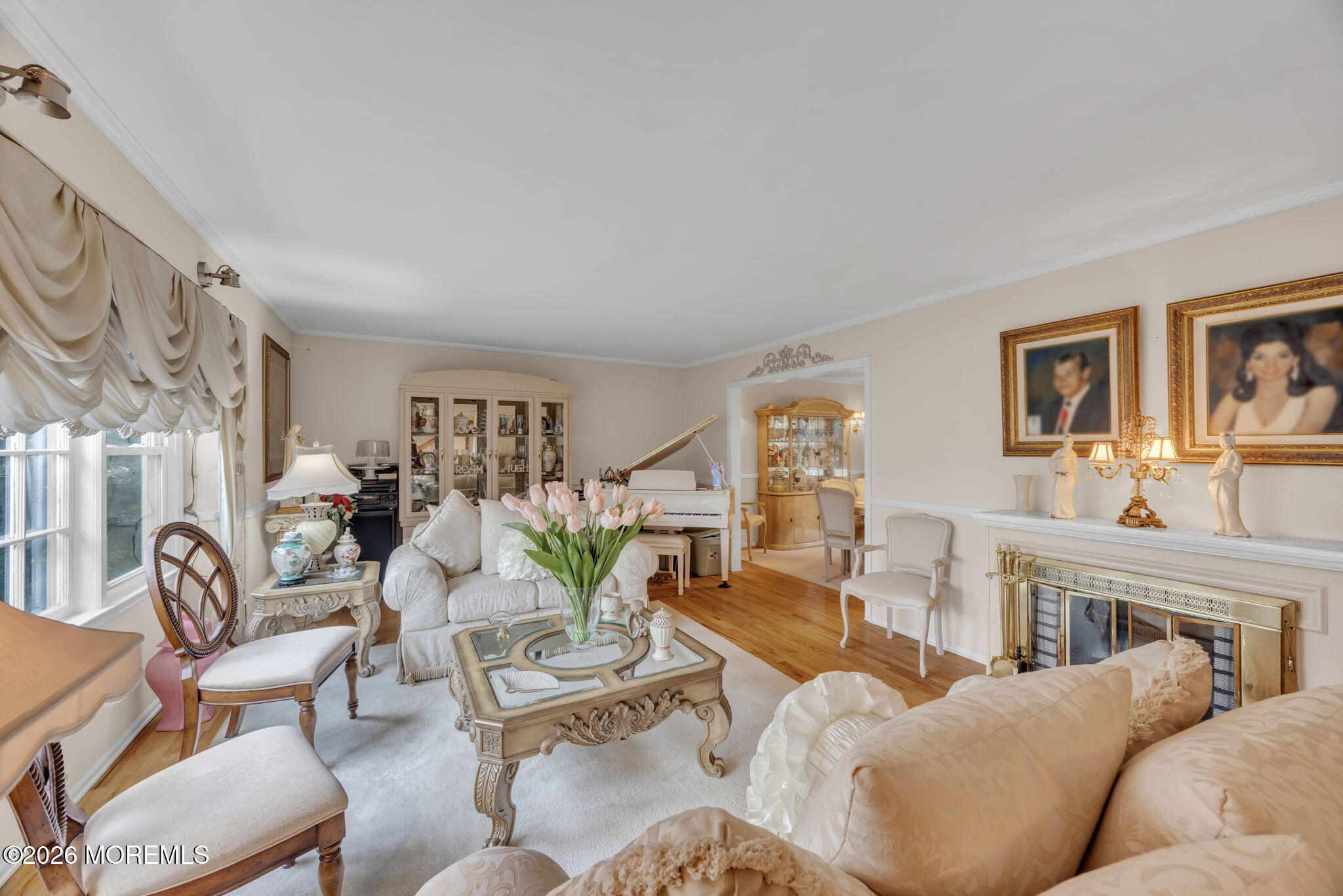 12 Avon Way Parlin, NJ 08859 - Photo 7 of 29 a living room with furniture a fireplace and a large window