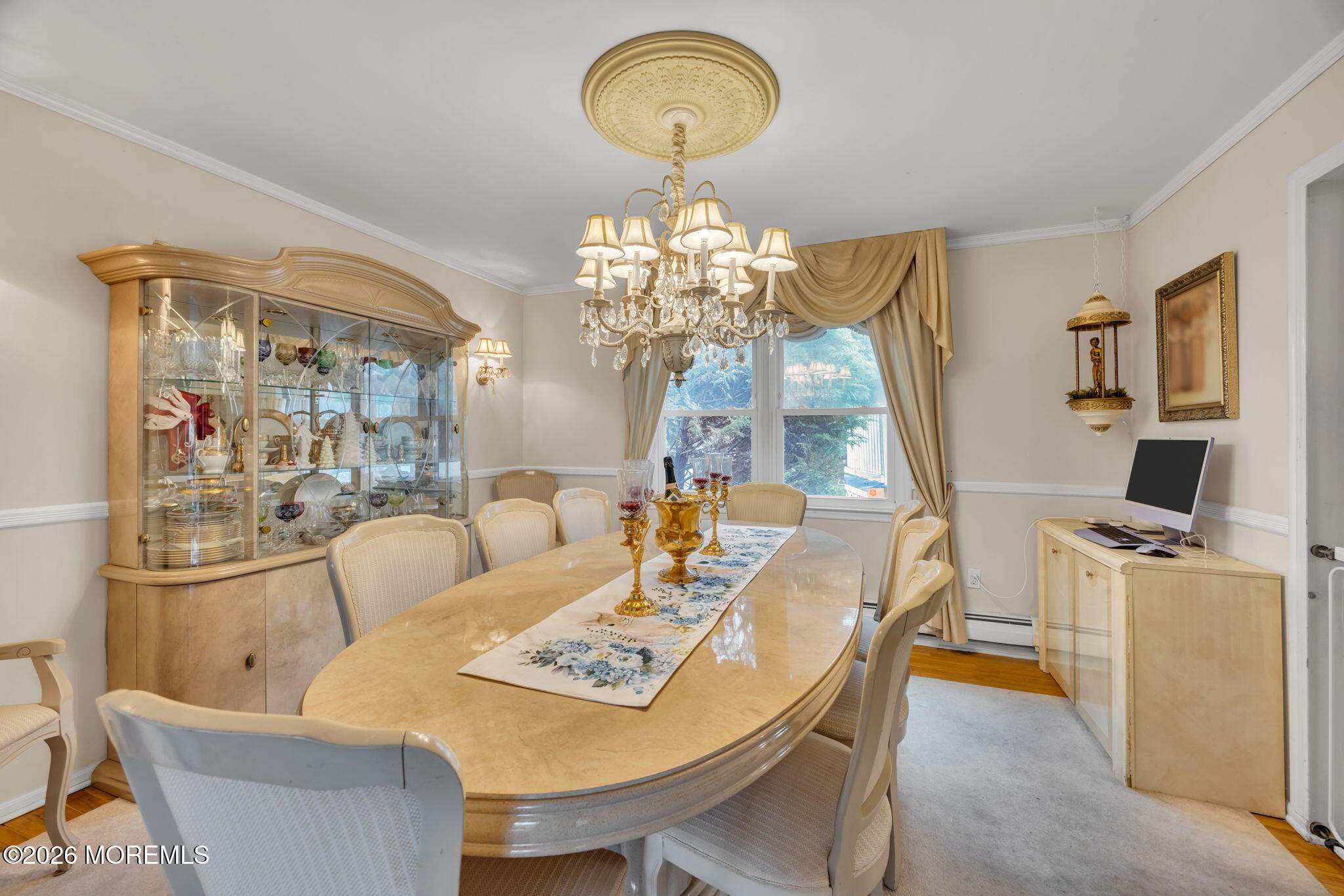 12 Avon Way Parlin, NJ 08859 - Photo 8 of 29 a view of a dining room with furniture a chandelier and wooden floor