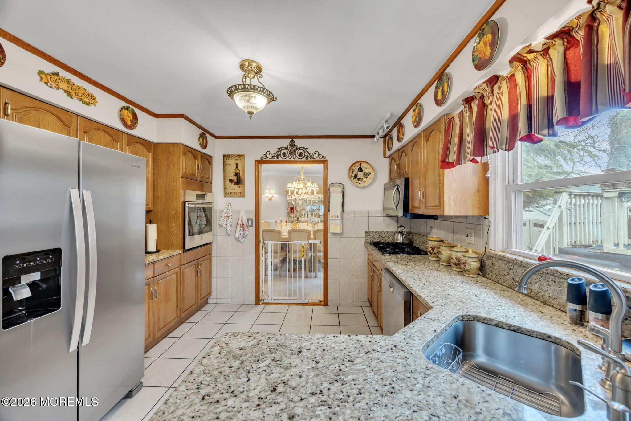 12 Avon Way Parlin, NJ 08859 - Photo 9 of 29 a kitchen with stainless steel appliances granite countertop a stove a sink and a refrigerator