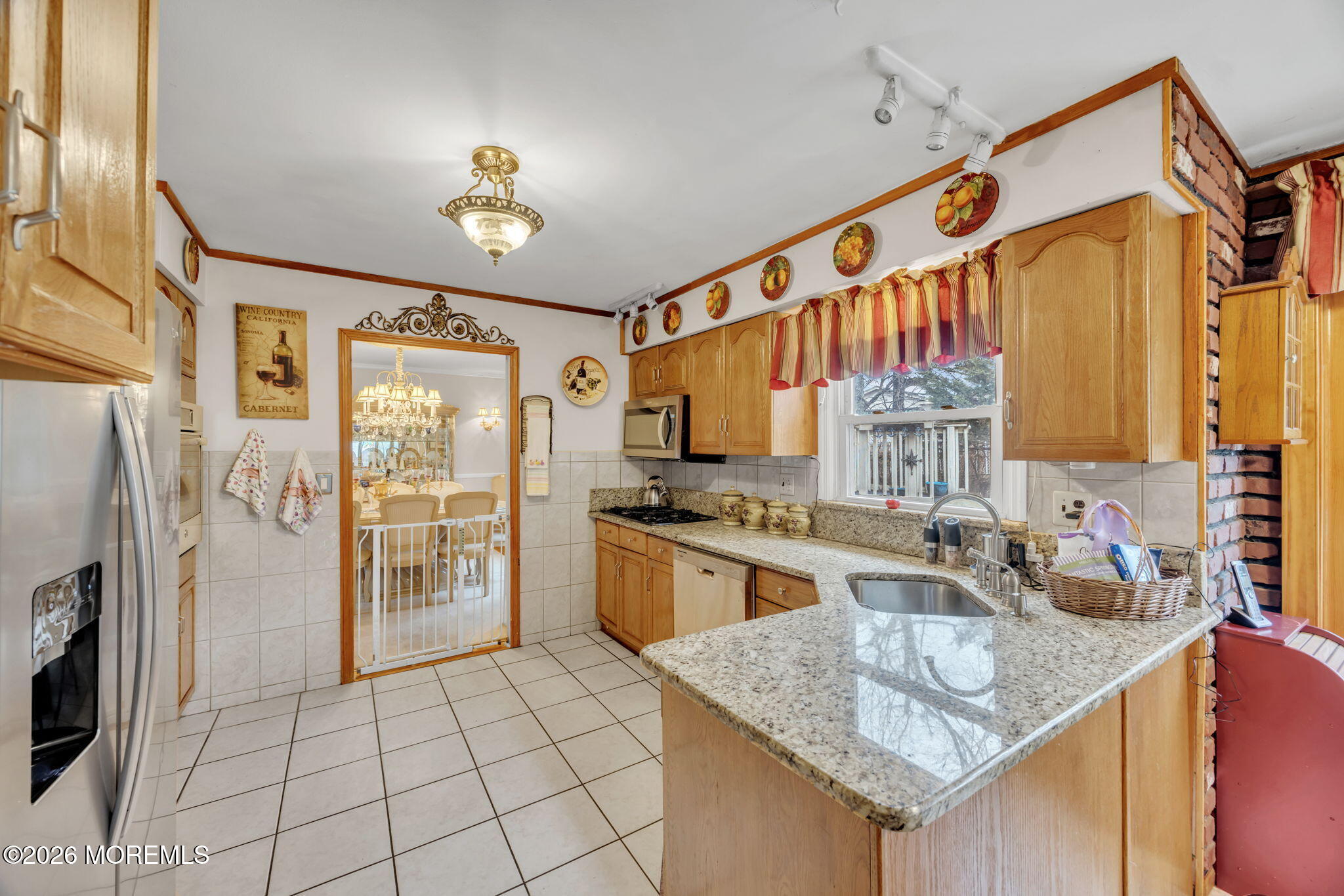 12 Avon Way Parlin, NJ 08859 - Photo 10 of 29 a kitchen with stainless steel appliances granite countertop a sink stove and refrigerator