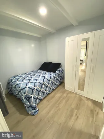 a bedroom with a bed and a cabinets