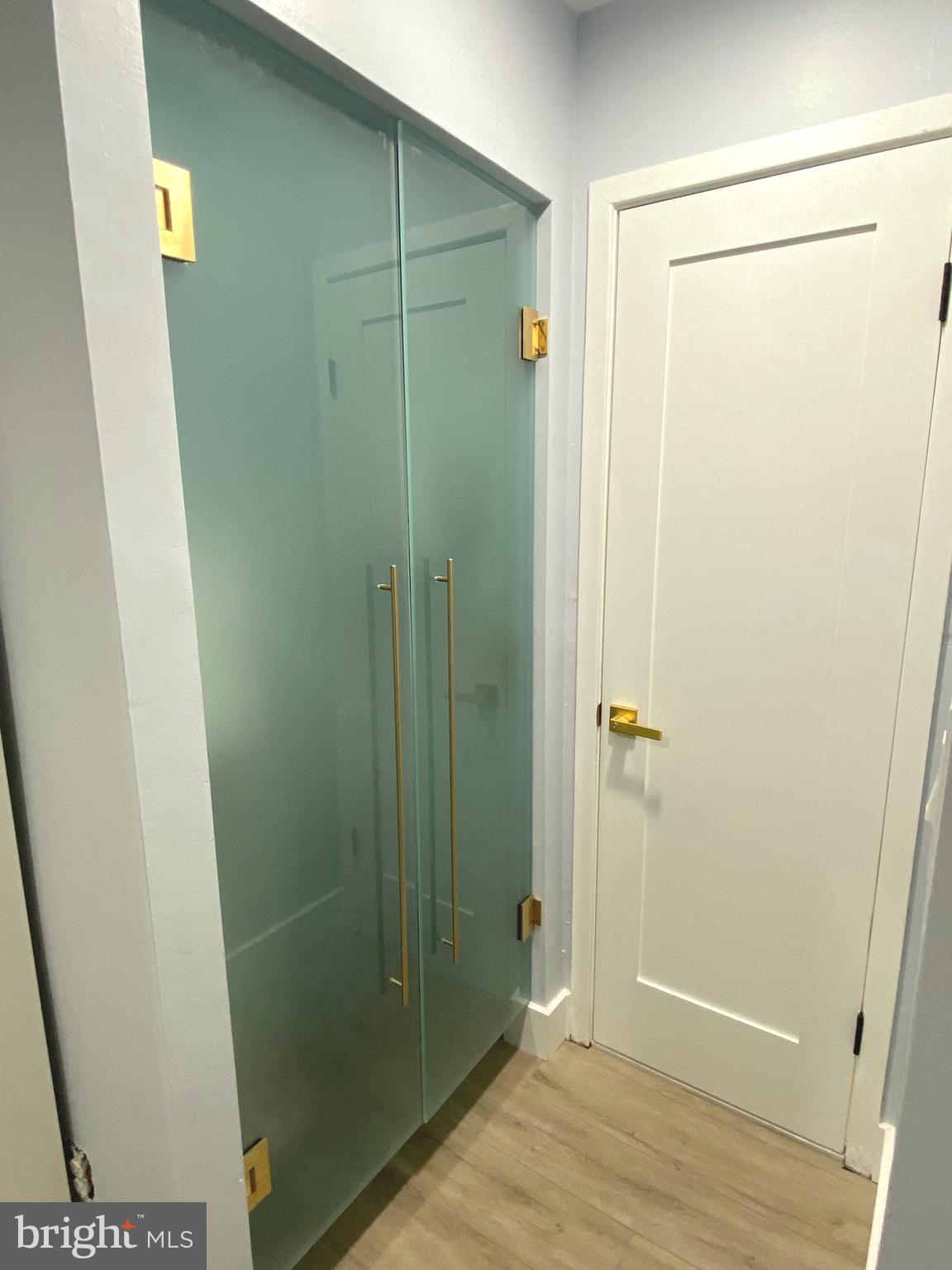 9712 Hellingly Place, Unit 209 Gaithersburg, MD 20886 - Photo 16 of 29 a bathroom with a glass door shower