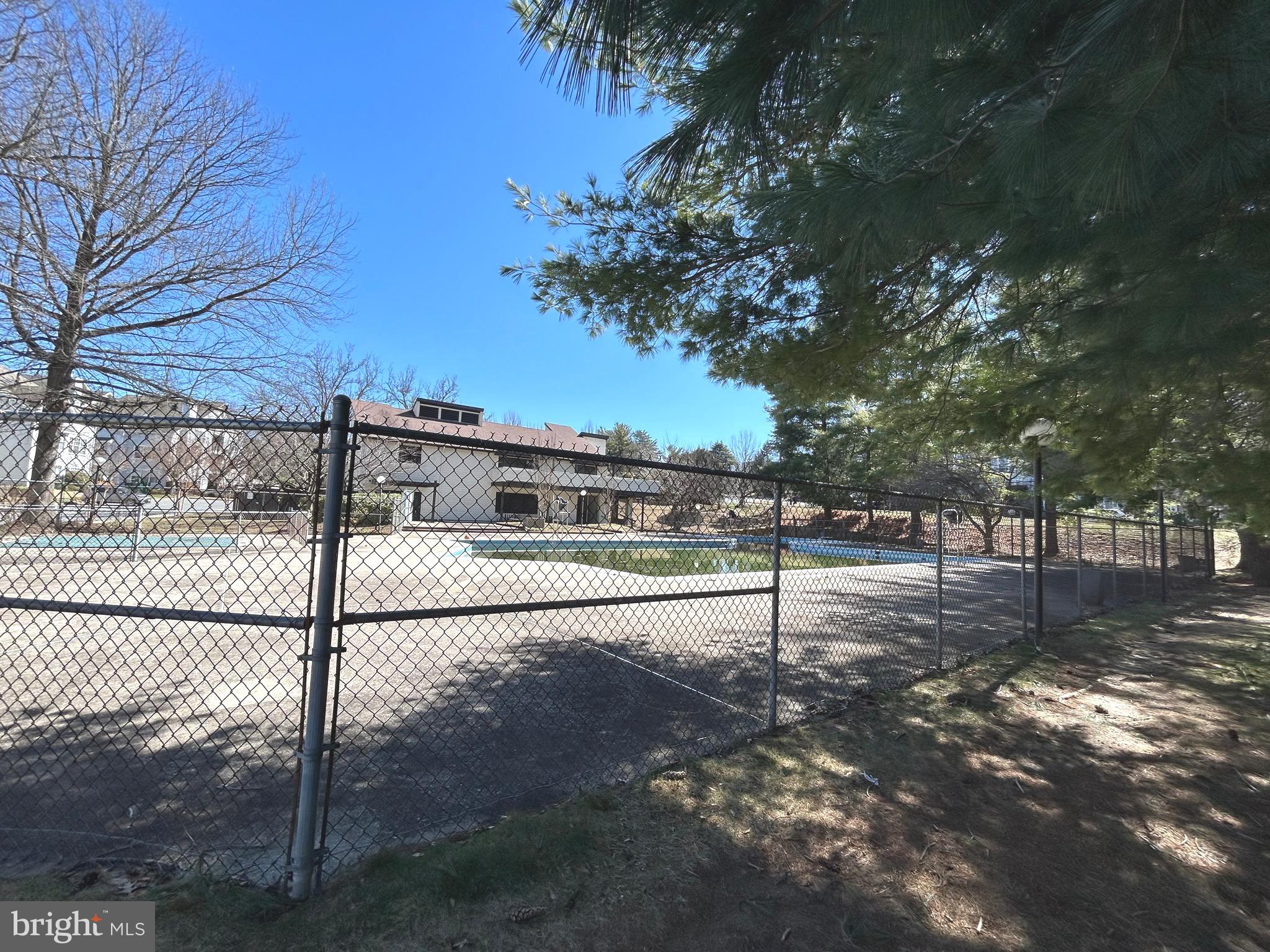 9712 Hellingly Place, Unit 209 Gaithersburg, MD 20886 - Photo 22 of 29 a view of a yard with a tree