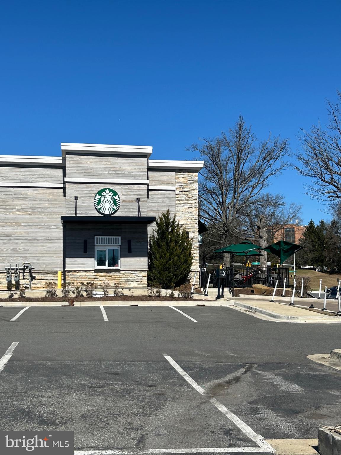 9712 Hellingly Place, Unit 209 Gaithersburg, MD 20886 - Photo 25 of 29 a view of a building and a street