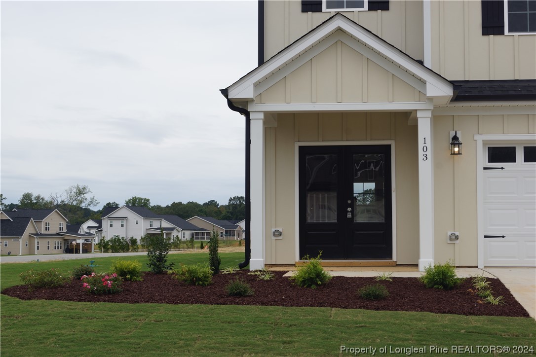 103 Grinnel Loop Sanford, NC 27332 - Photo 2 of 39 a front view of a house with a yard