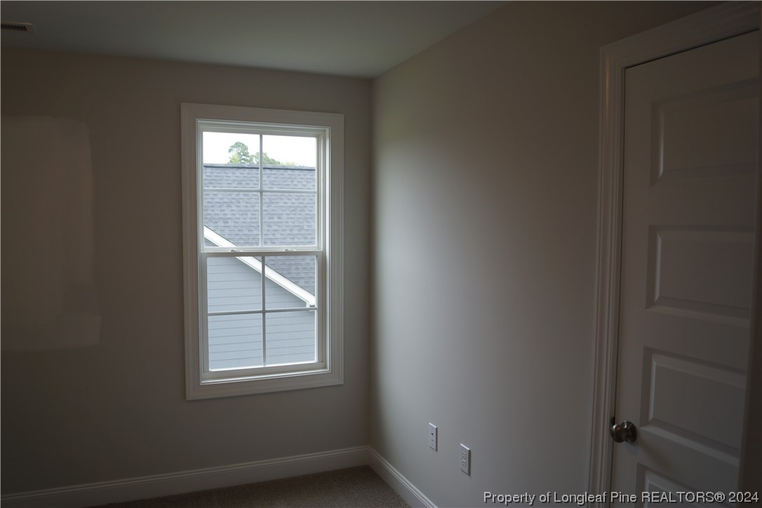 103 Grinnel Loop Sanford, NC 27332 - Photo 32 of 39 a view of an empty room with a window