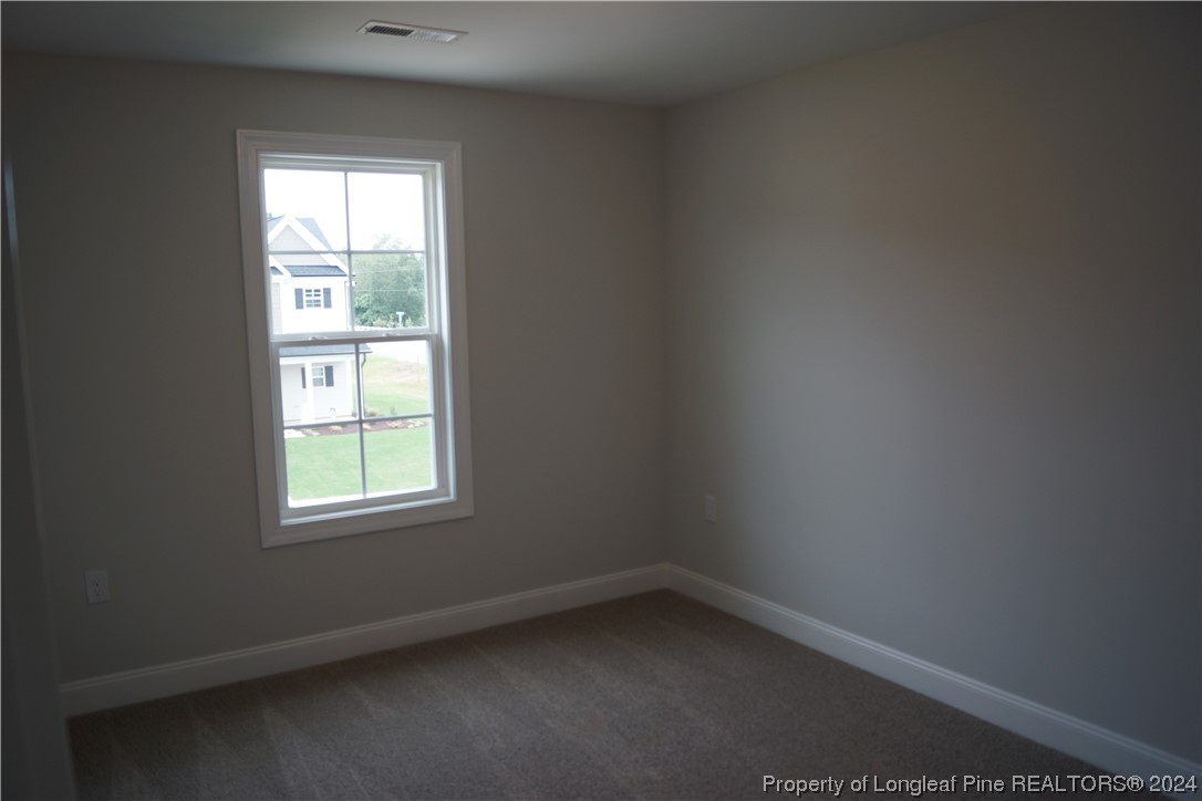 103 Grinnel Loop Sanford, NC 27332 - Photo 34 of 39 an empty room with a window