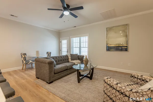 a living room with furniture and a window