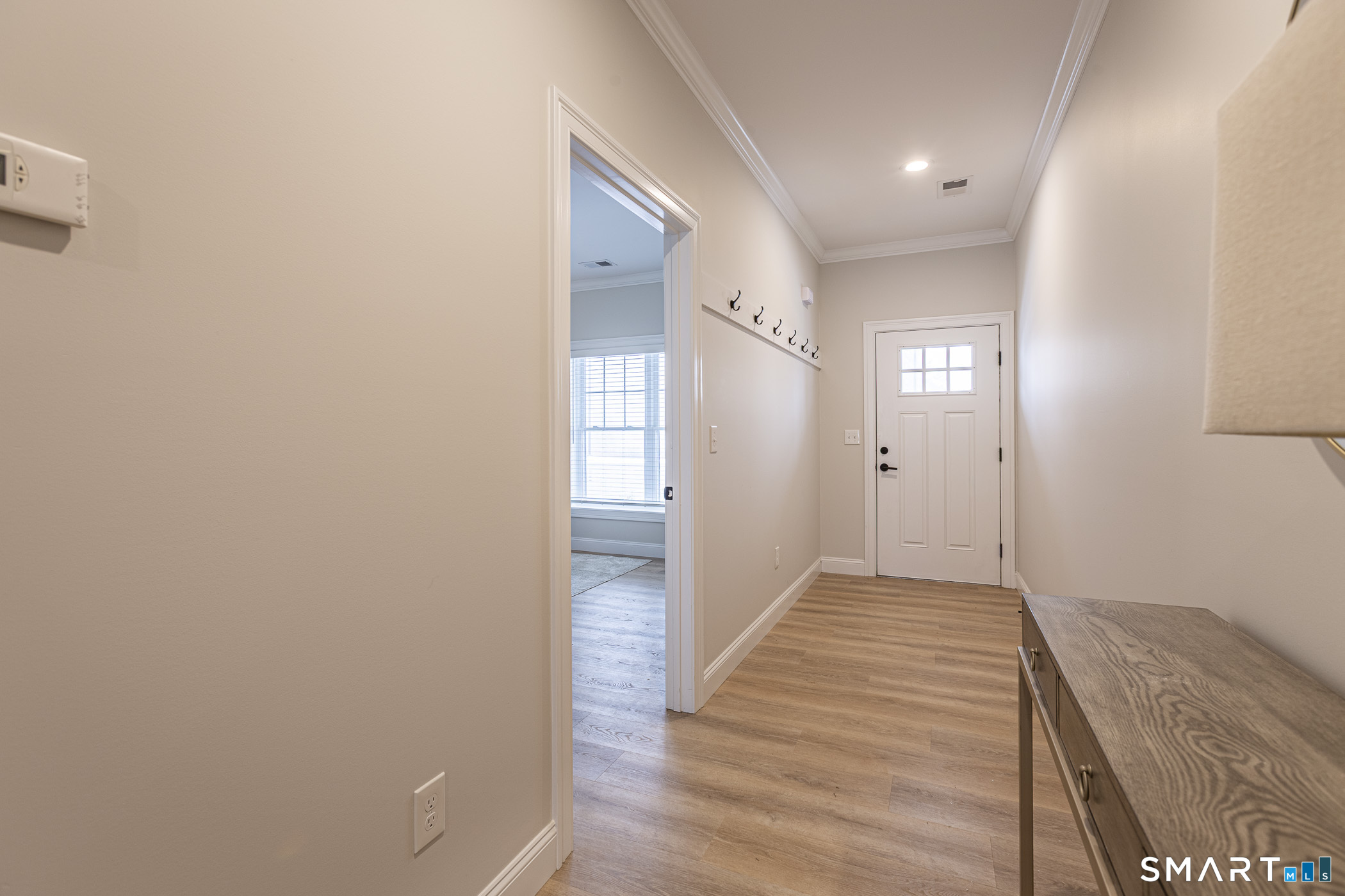 7 Loomis Road, Unit C Bolton, CT 06043 - Photo 17 of 26 a view of hallway with wooden floor