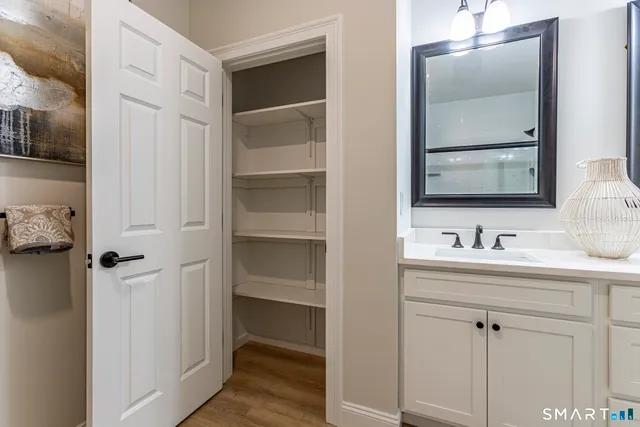 a bathroom with a sink and mirror
