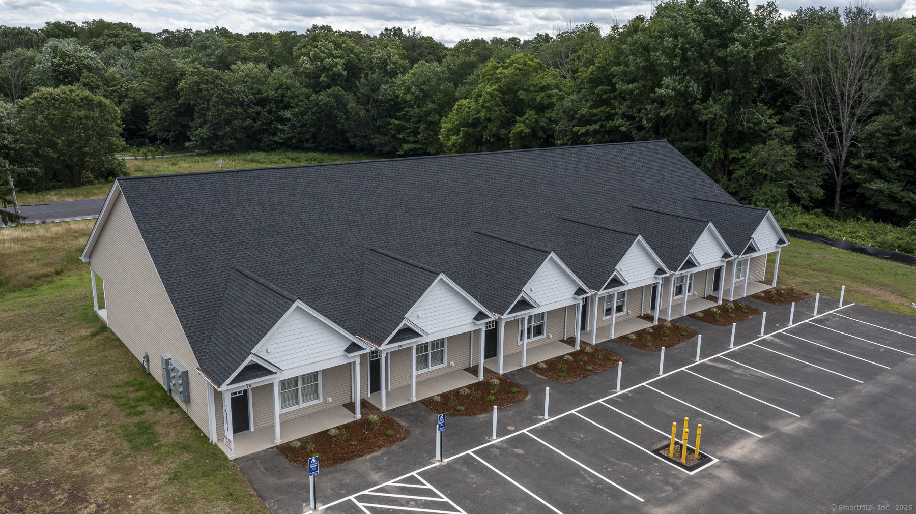 7 Loomis Road, Unit C Bolton, CT 06043 - Photo 3 of 26 a aerial view of a house with a yard
