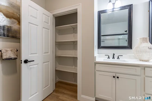 a bathroom with a sink and mirror