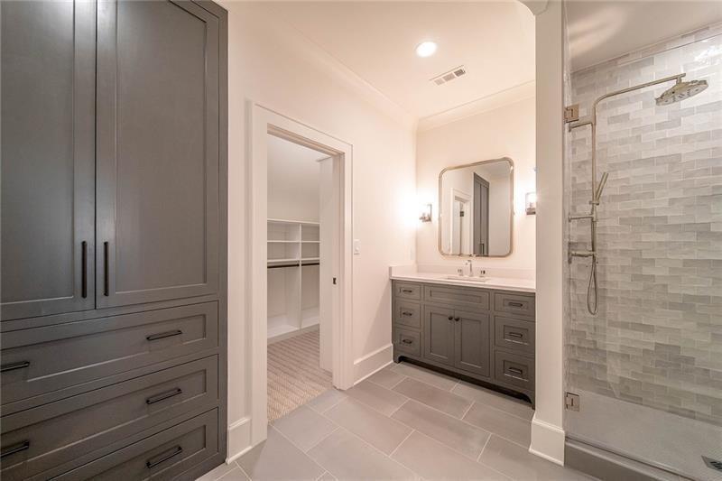 10210 Cedar Ridge Drive Milton, GA 30004 - Photo 16 of 17 a bathroom with a granite countertop sink mirror and shower
