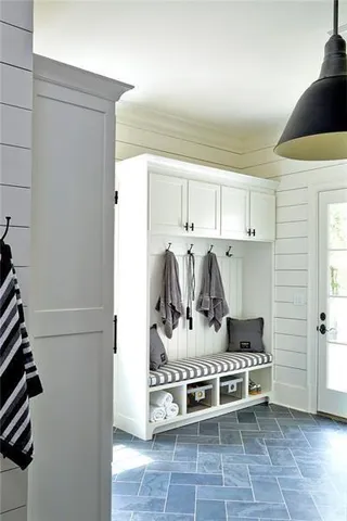 a kitchen with stainless steel appliances granite countertop a stove and a refrigerator